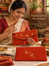 Artisan hand embroidering the Gerua Khadi shagun envelope