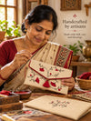 Artisan hand embroidering the Gulmohar Khadi shagun envelope