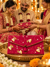 Rani Khadi shagun envelope at an Indian wedding