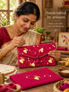 Artisan hand embroidering the Rani Khadi shagun envelope