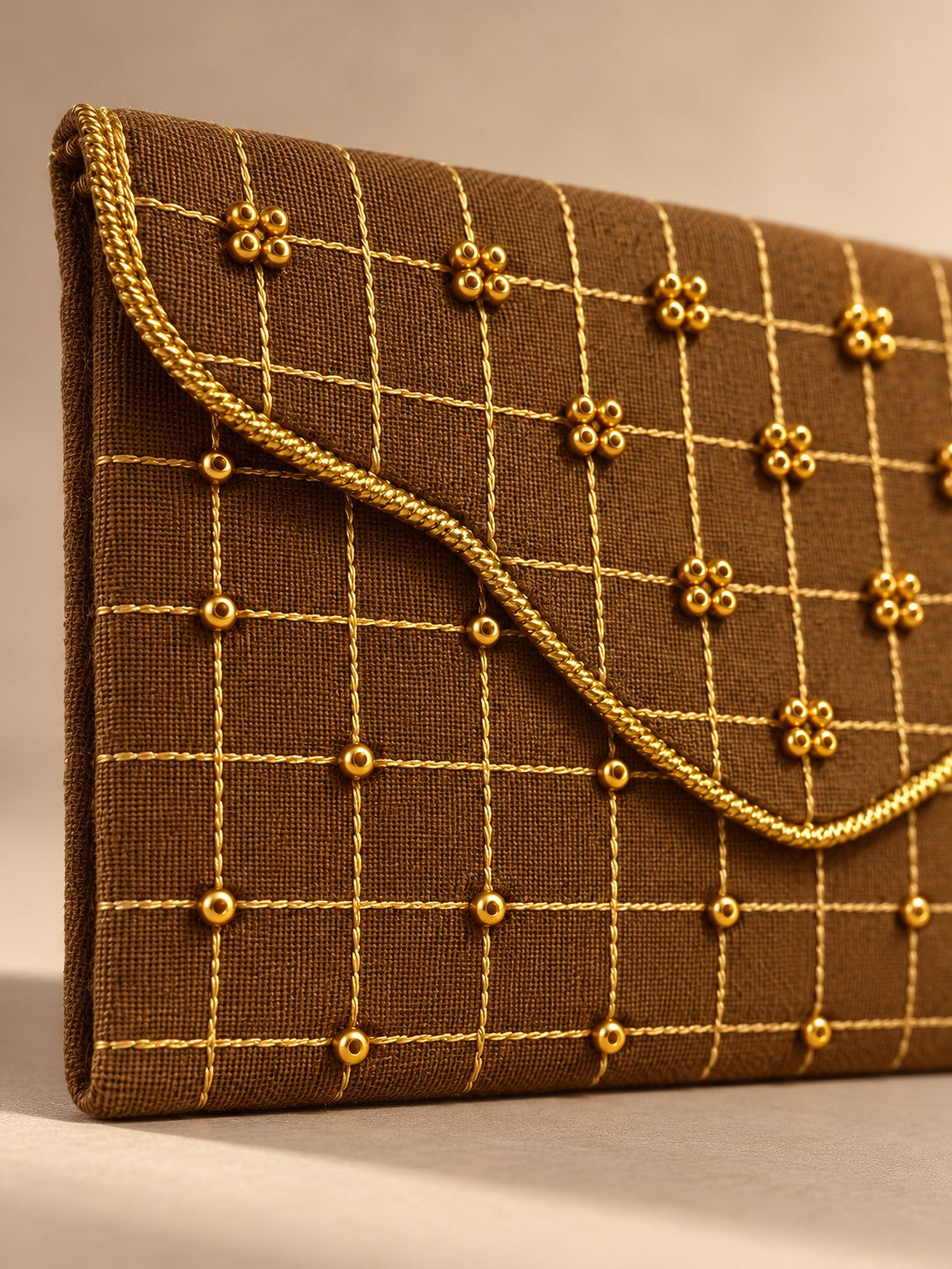 Close-up of hand embroidery on the Sunehri Khadi shagun envelope