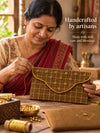 Artisan hand embroidering the Sunehri Khadi shagun envelope