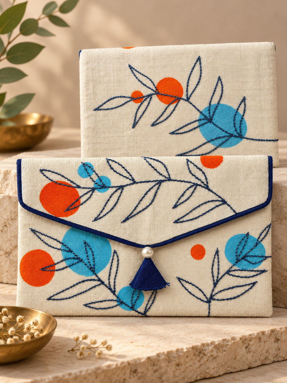 Front and back of the Tehni Khadi shagun envelope with navy twig embroidery