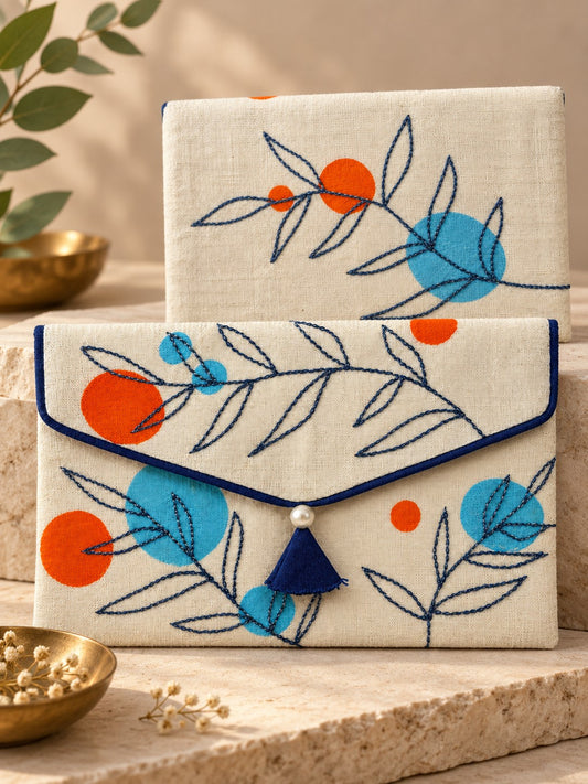 Front and back of the Tehni Khadi shagun envelope with navy twig embroidery
